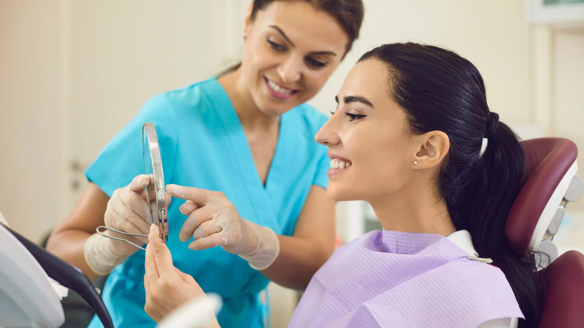 lady patient with a lady dentist talking about teeth whitening in chandigarh